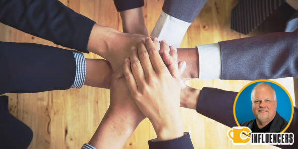 A group of hands put together towards the center, overlay of Will Lorenz’s headshot in bottom right