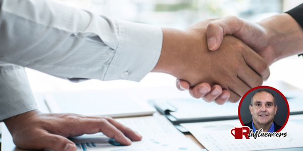 close up shot on the hands of two business people shaking, John Kenney’s headshot in the bottom right close up shot on the hands of two business people shaking, John Kenney’s headshot in the bottom right